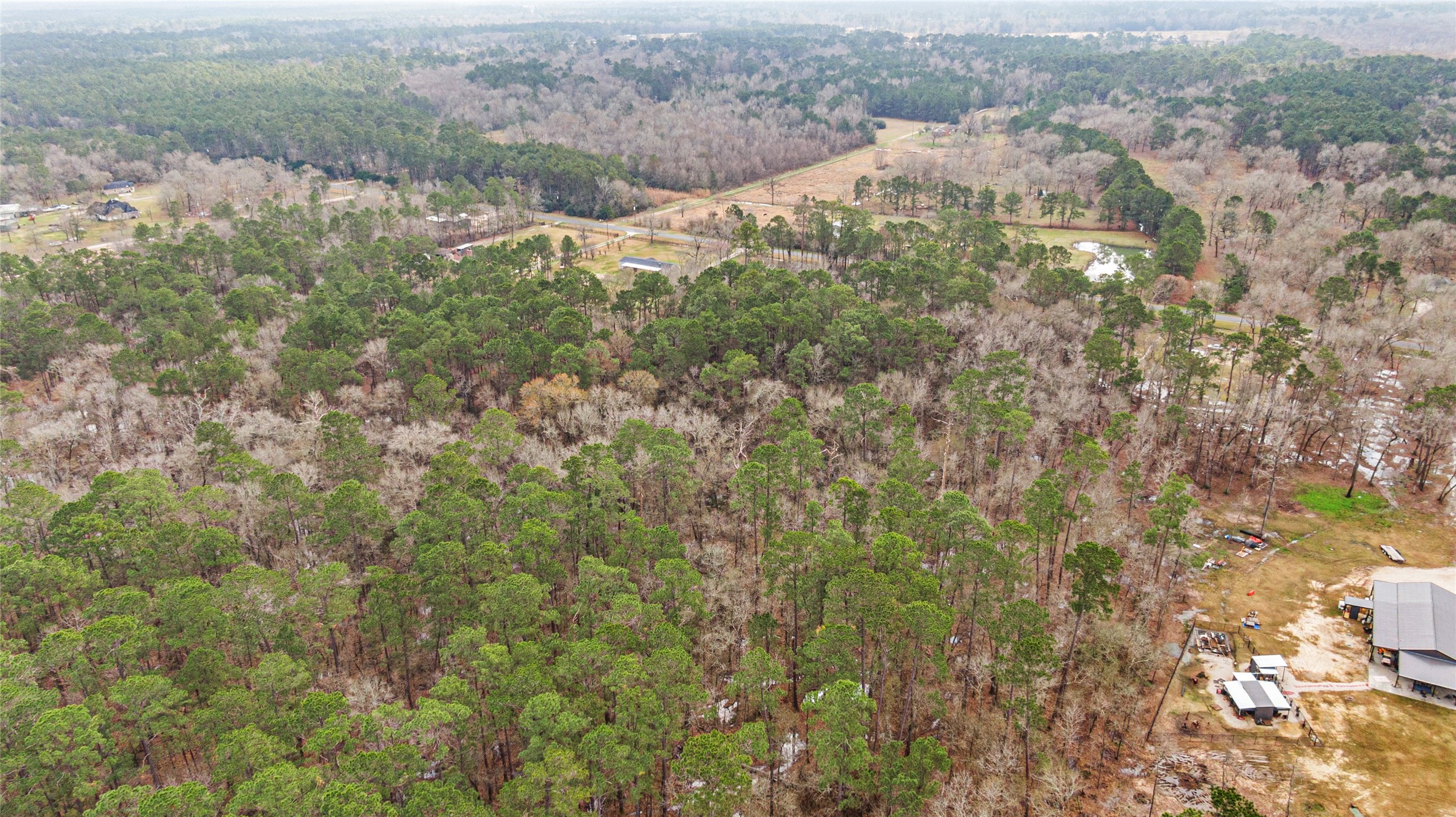 Aerial looking south from the back side of the property