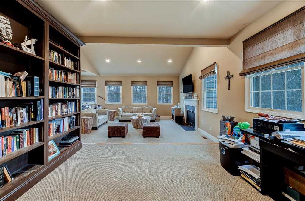 107 Roundhill Road East Fishkill, NY 12533 - Photo 16 of 38 a living room with furniture and a book shelf