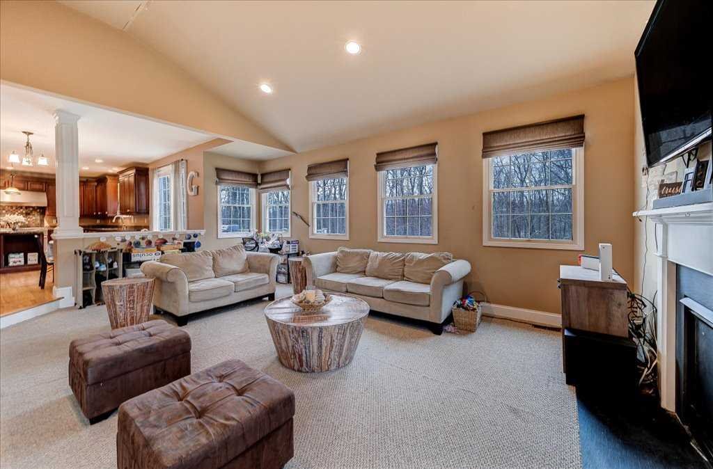 107 Roundhill Road East Fishkill, NY 12533 - Photo 17 of 38 a living room with furniture fireplace and a flat screen tv