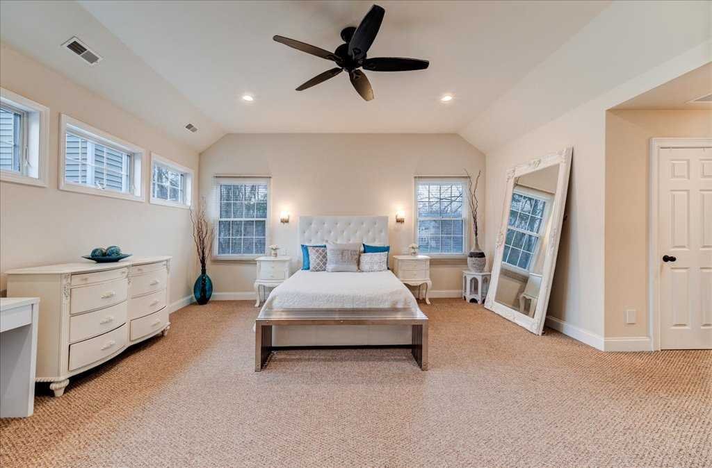 107 Roundhill Road East Fishkill, NY 12533 - Photo 19 of 38 a spacious bedroom with a bed and a walk in closet