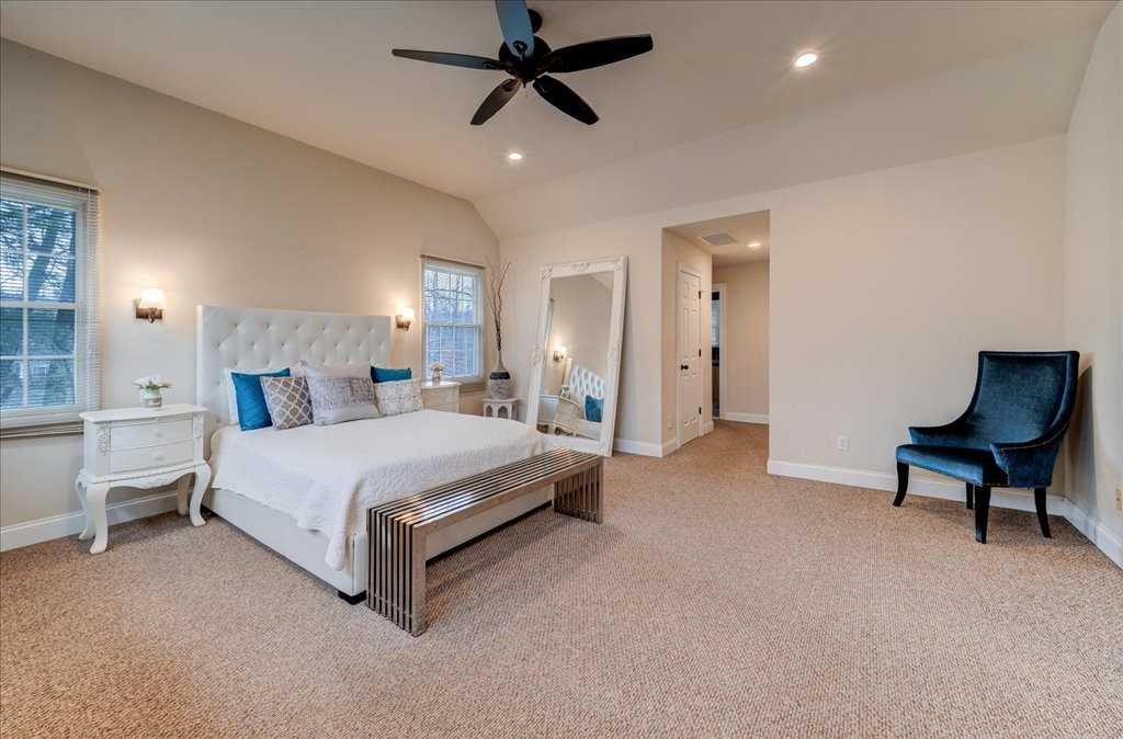 107 Roundhill Road East Fishkill, NY 12533 - Photo 20 of 38 a spacious bedroom with a bed and a chair