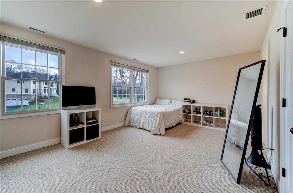 107 Roundhill Road East Fishkill, NY 12533 - Photo 23 of 38 a bedroom with furniture and a flat screen tv