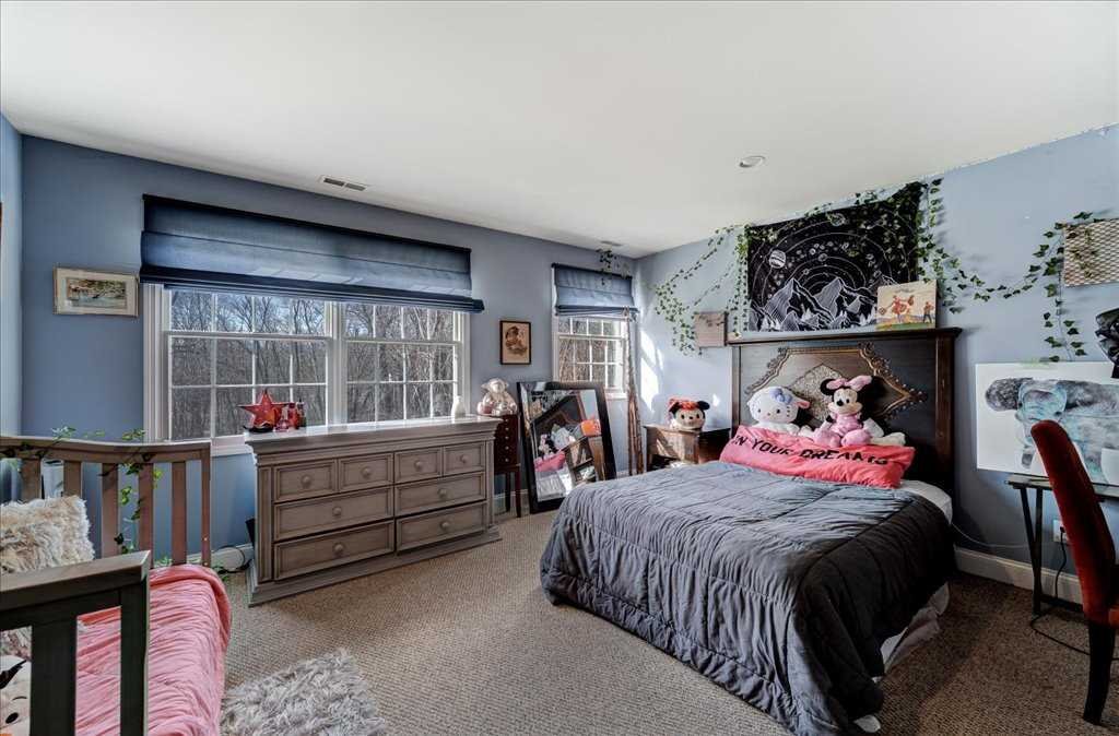 107 Roundhill Road East Fishkill, NY 12533 - Photo 24 of 38 a bed room with a bed and a window