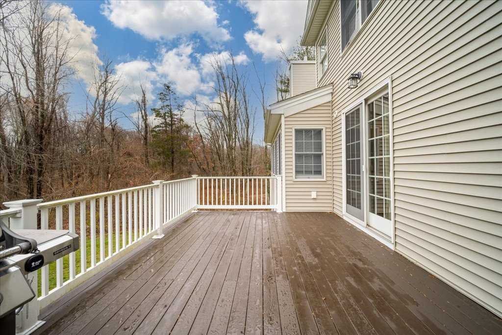 107 Roundhill Road East Fishkill, NY 12533 - Photo 32 of 38 a view of a wooden deck with a yard