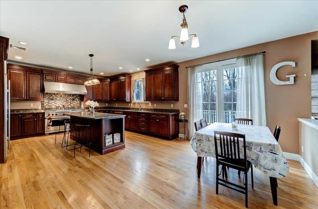 107 Roundhill Road East Fishkill, NY 12533 - Photo 9 of 38 a open kitchen with stainless steel appliances granite countertop a stove and refrigerator