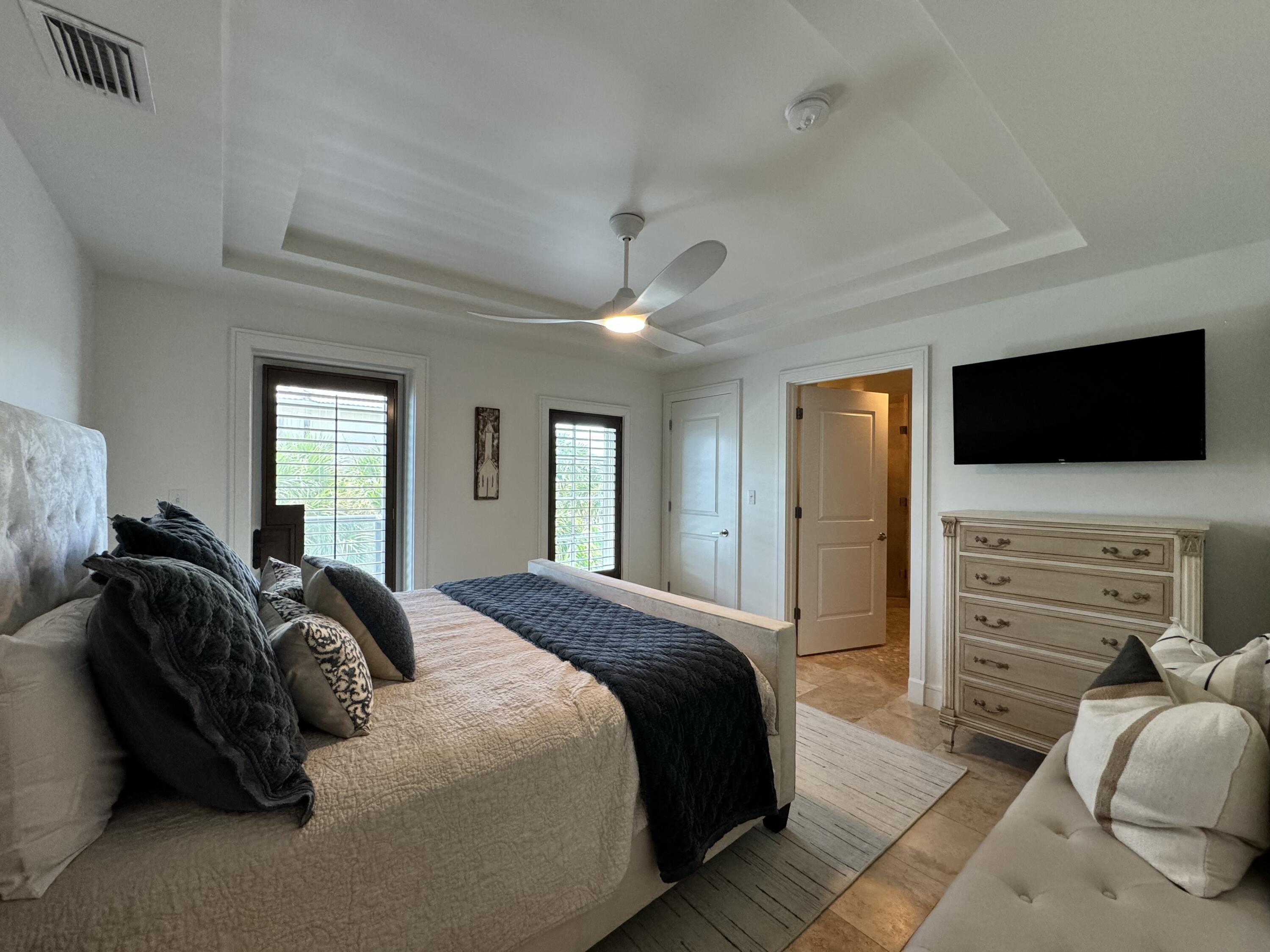 4128 East County Highway 30A, Unit 204 Santa Rosa Beach, FL 32459 - Photo 2 of 4 a spacious bedroom with a bed and a flat screen tv