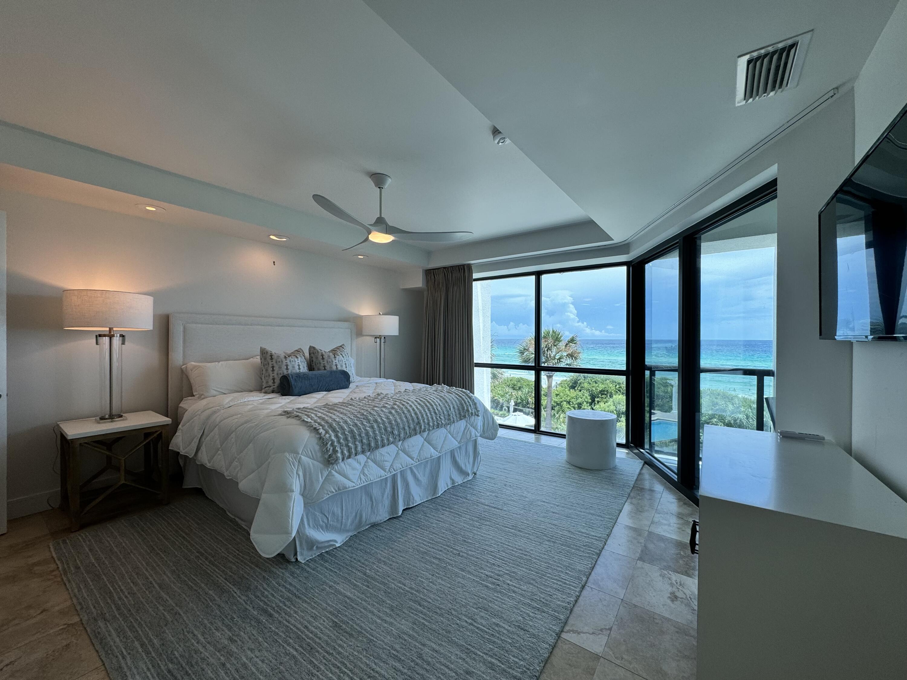 4128 East County Highway 30A, Unit 204 Santa Rosa Beach, FL 32459 - Photo 3 of 4 a spacious bedroom with a large bed and a large window