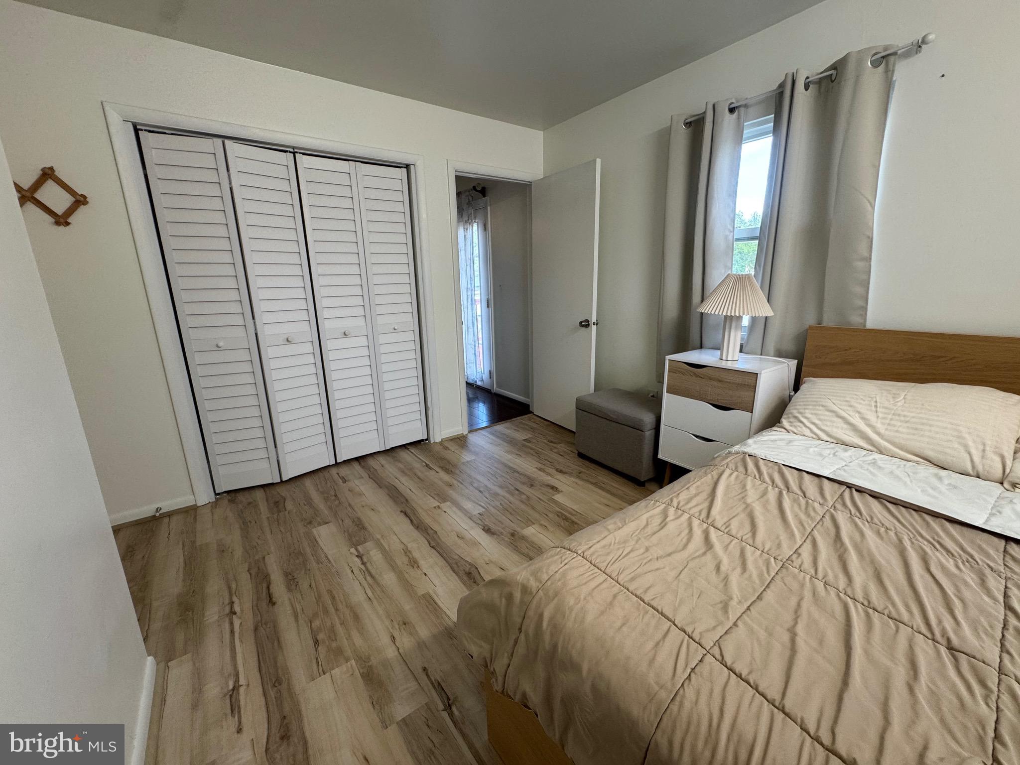 212 11th Street Laurel, MD 20707 - Photo 16 of 39 a bedroom with a bed and a large window