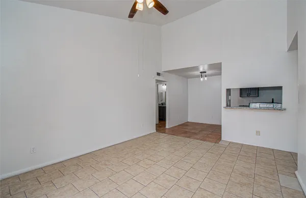 a view of a kitchen from the hallway