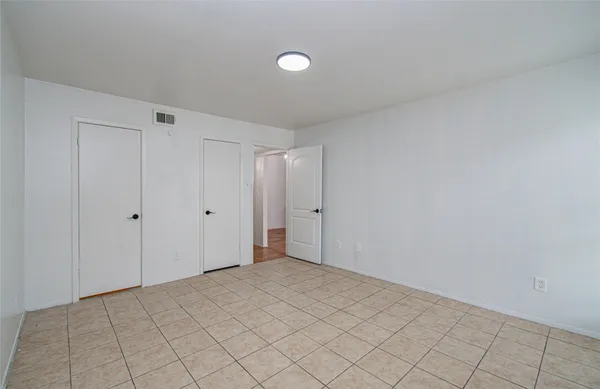 a bathroom with a granite countertop bathtub sink vanity and mirror