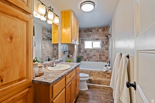 115 East 1600th Street North Santaquin, UT 84655 - Photo 18 of 52 Bathroom featuring a light wood-finish vanity with an integrated sink and a speckled countertop