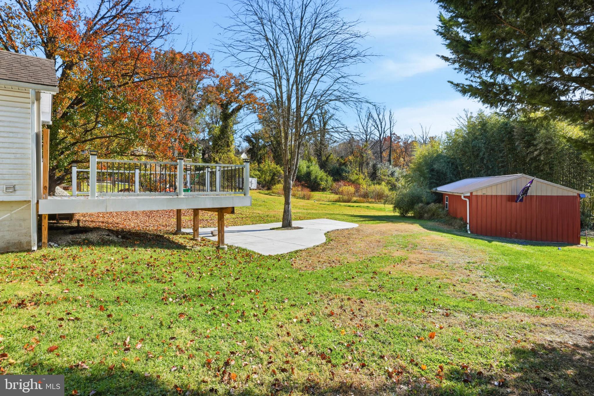 2405 Jerusalem Road Joppa, MD 21085 - Photo 22 of 23 Serene backyard with vibrant autumn hues.
