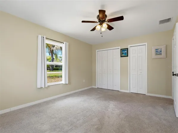 a view of a livingroom with a ceiling fan