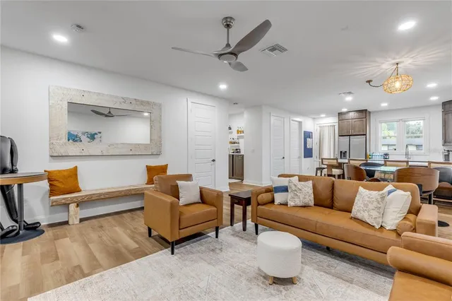 a room with furniture a chandelier and a window