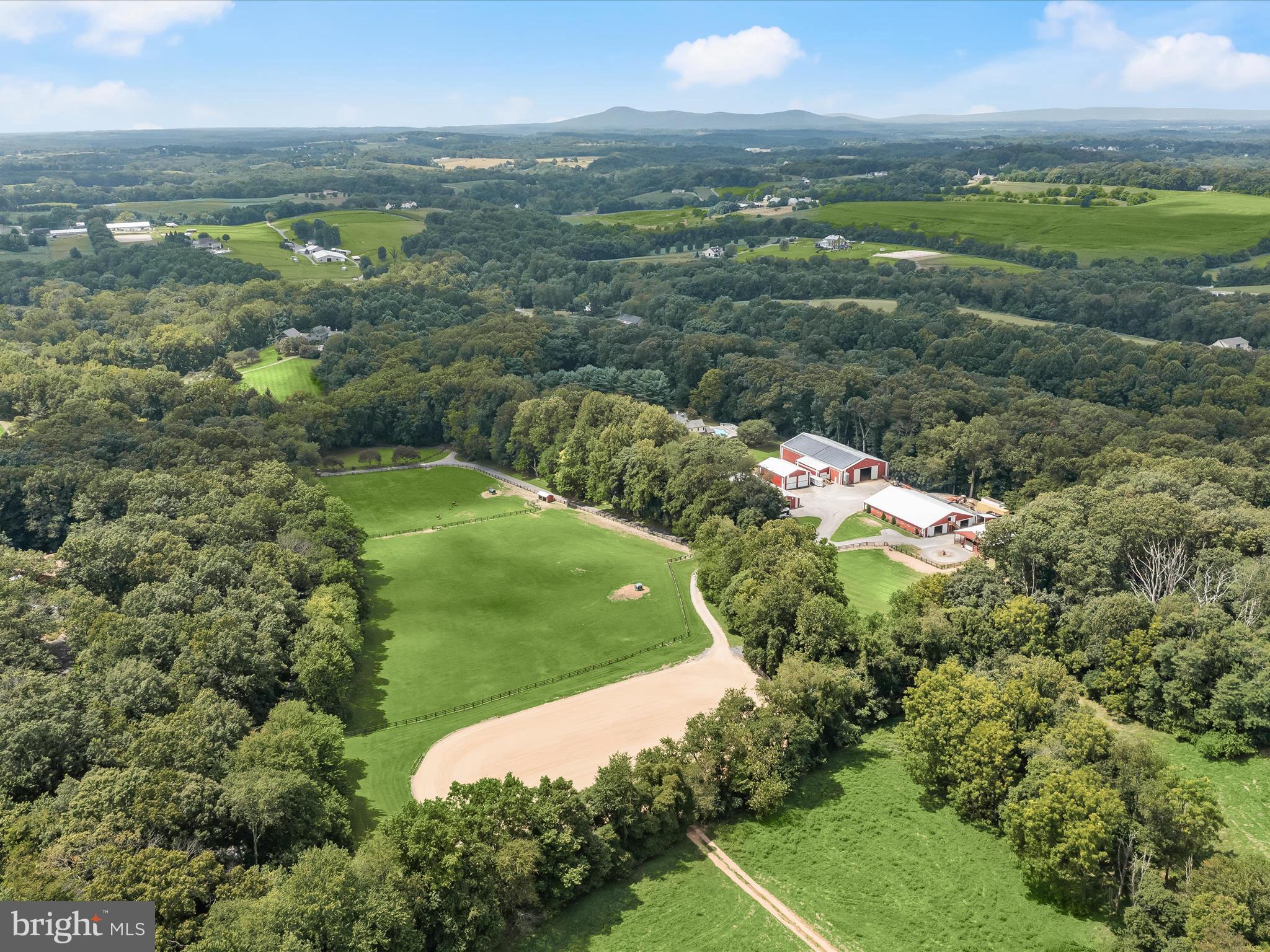 10901 Moxley Road Damascus, MD 20872 - Photo 133 of 148 an aerial view of residential houses with outdoor space and trees