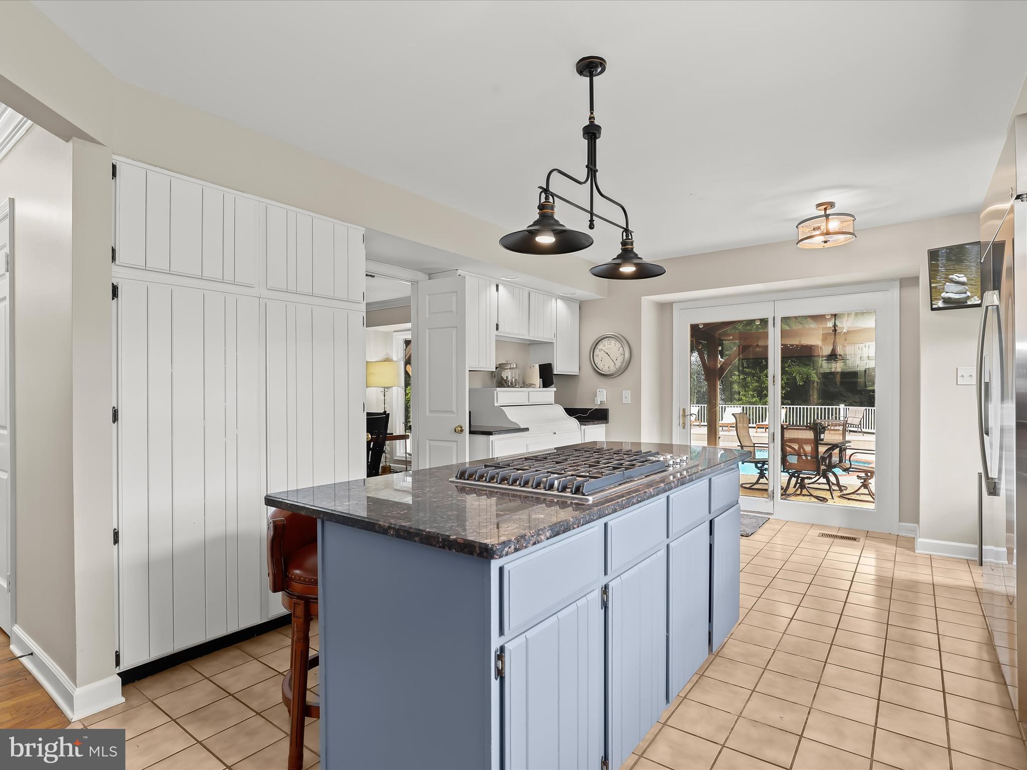 10901 Moxley Road Damascus, MD 20872 - Photo 21 of 148 a kitchen with stainless steel appliances granite countertop a stove a sink dishwasher and a refrigerator with wooden floor