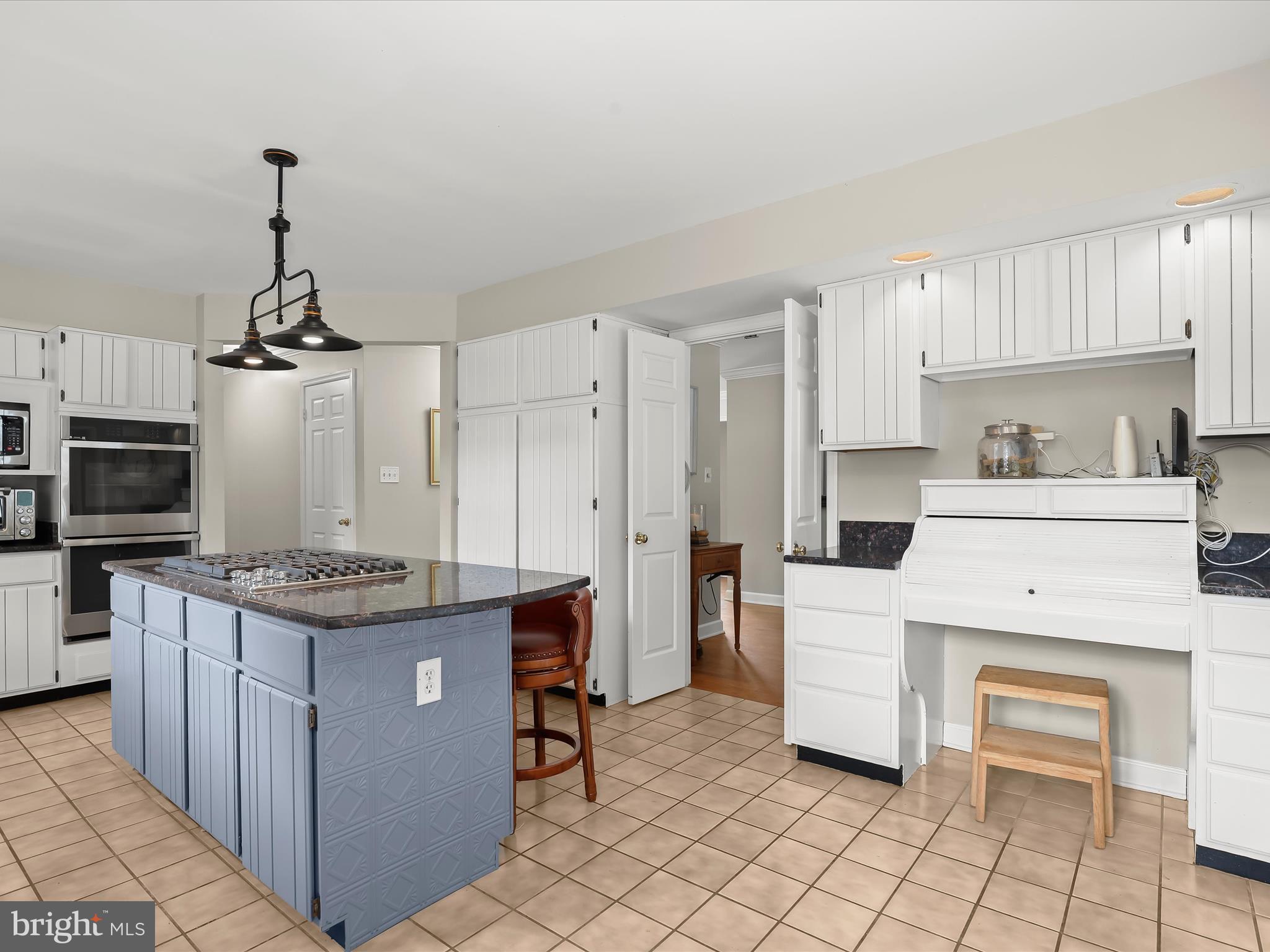 10901 Moxley Road Damascus, MD 20872 - Photo 25 of 148 a kitchen with a stove top oven and cabinets
