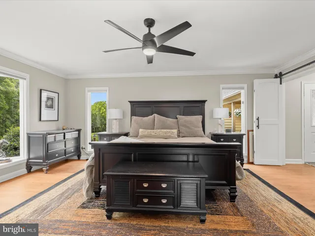 a living room with furniture a large window