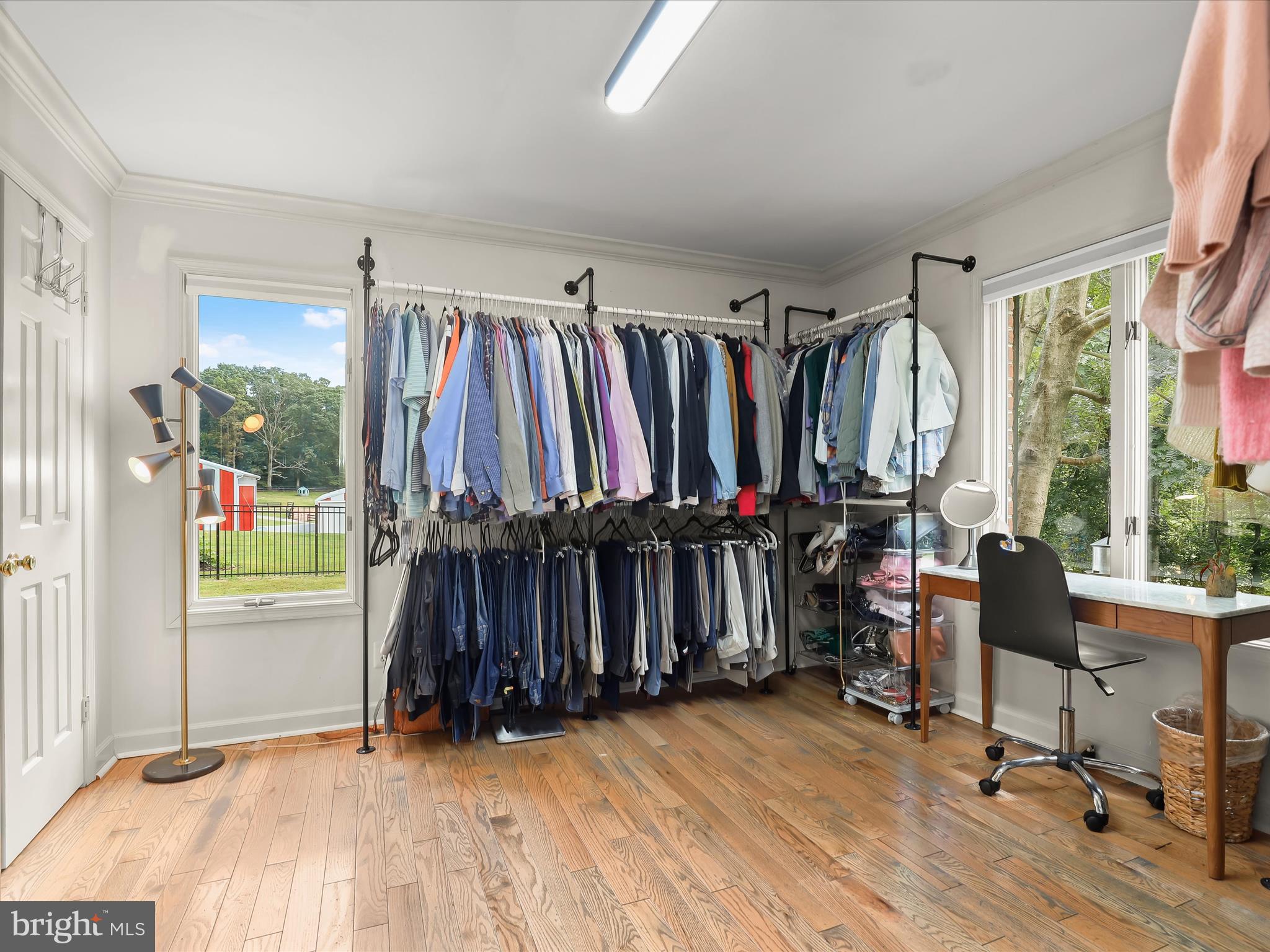 10901 Moxley Road Damascus, MD 20872 - Photo 34 of 148 a view of walk in closet with clothes and shoes