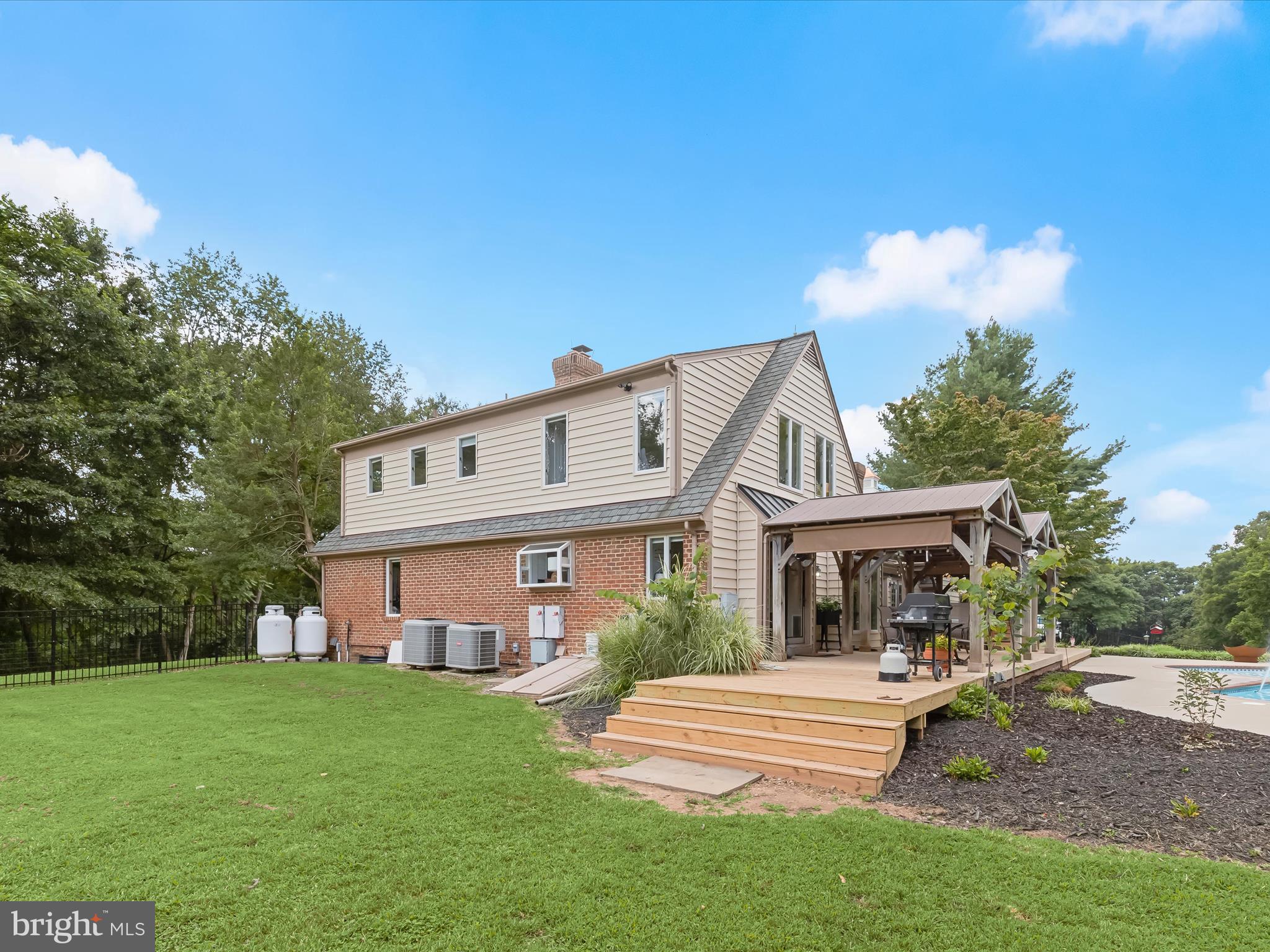 10901 Moxley Road Damascus, MD 20872 - Photo 56 of 148 a front view of a house with a garden