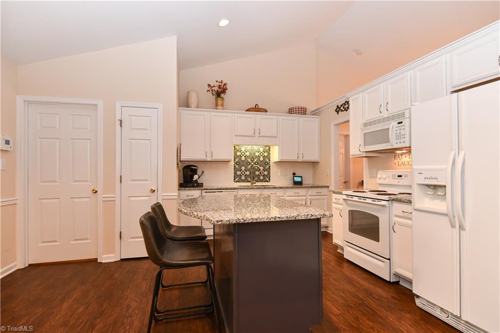 4700 Ridge Fall Road Greensboro, NC 27410 - Photo 8 of 23 All appliances remain. A small pantry and the entrance to the laundry room is here.