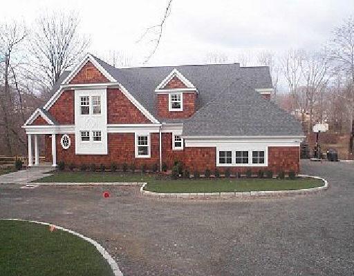 Prospect Ridge Road Ridgefield, CT 06877 - Photo 1 of 1 a front view of a house with a yard
