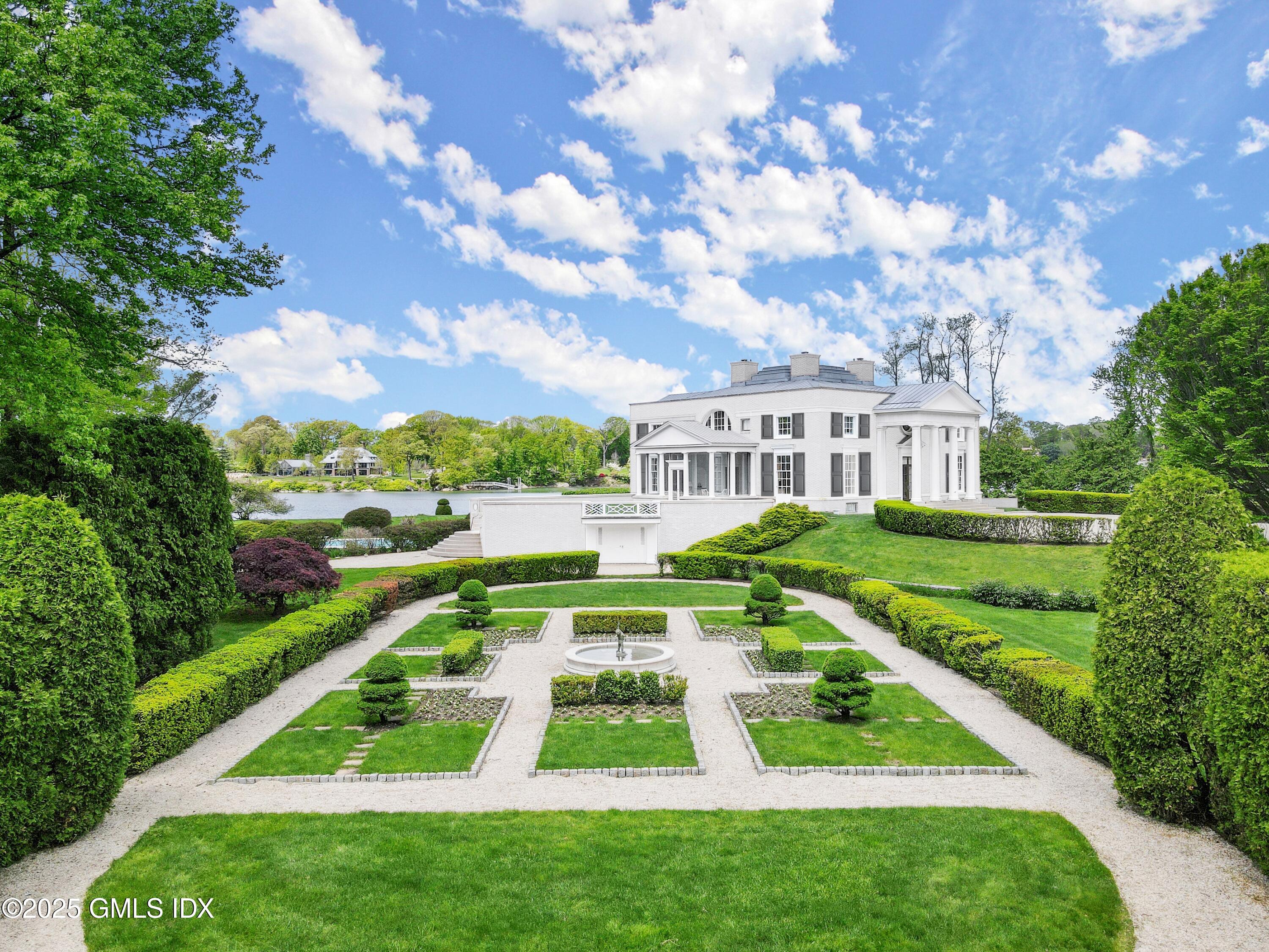 16 Windrose Way Greenwich, CT 06830 - Photo 12 of 18 a view of building with yard