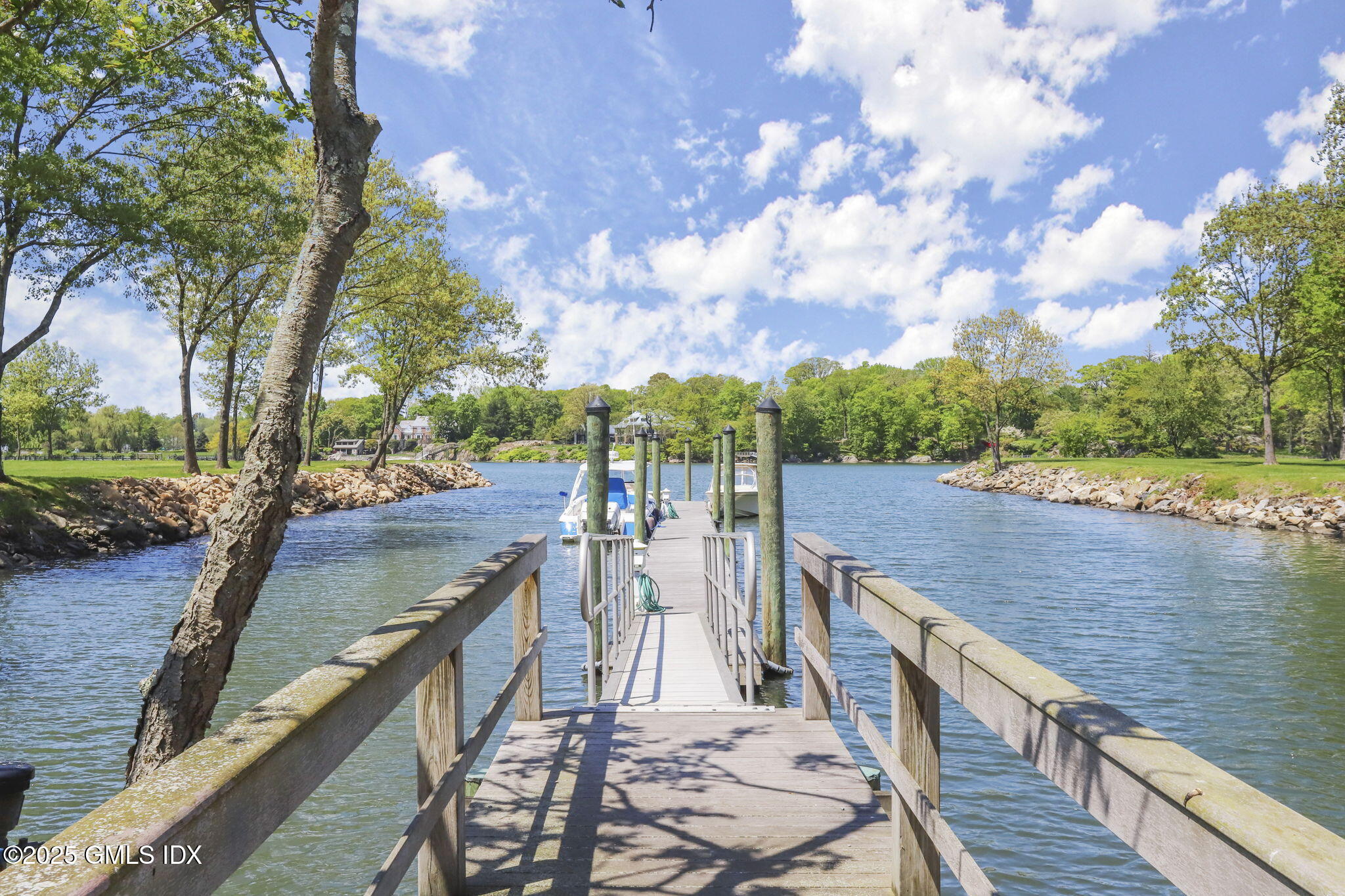 16 Windrose Way Greenwich, CT 06830 - Photo 16 of 18 a view of a lake with a deck