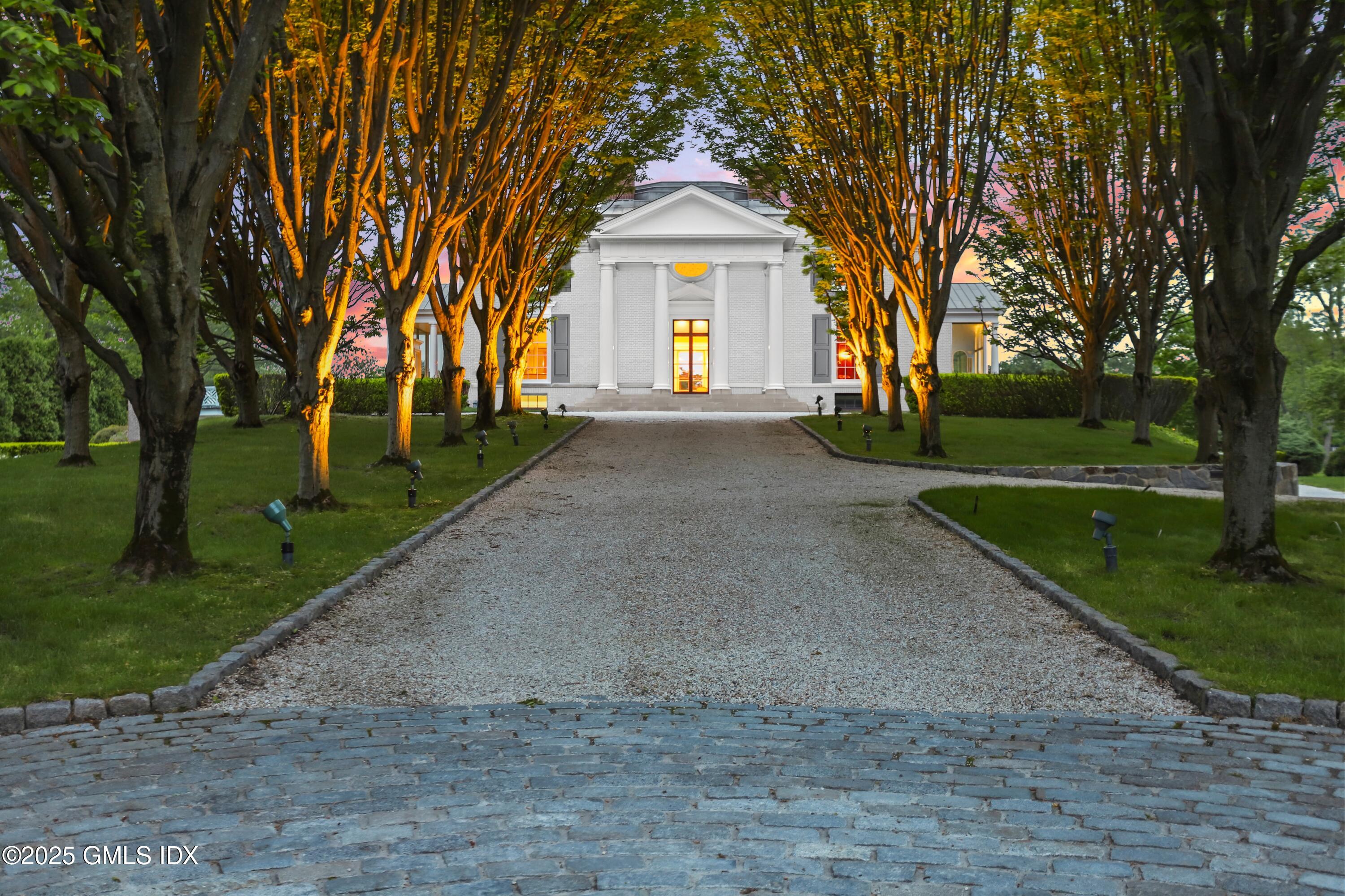 16 Windrose Way Greenwich, CT 06830 - Photo 18 of 18 a front view of a house with a yard