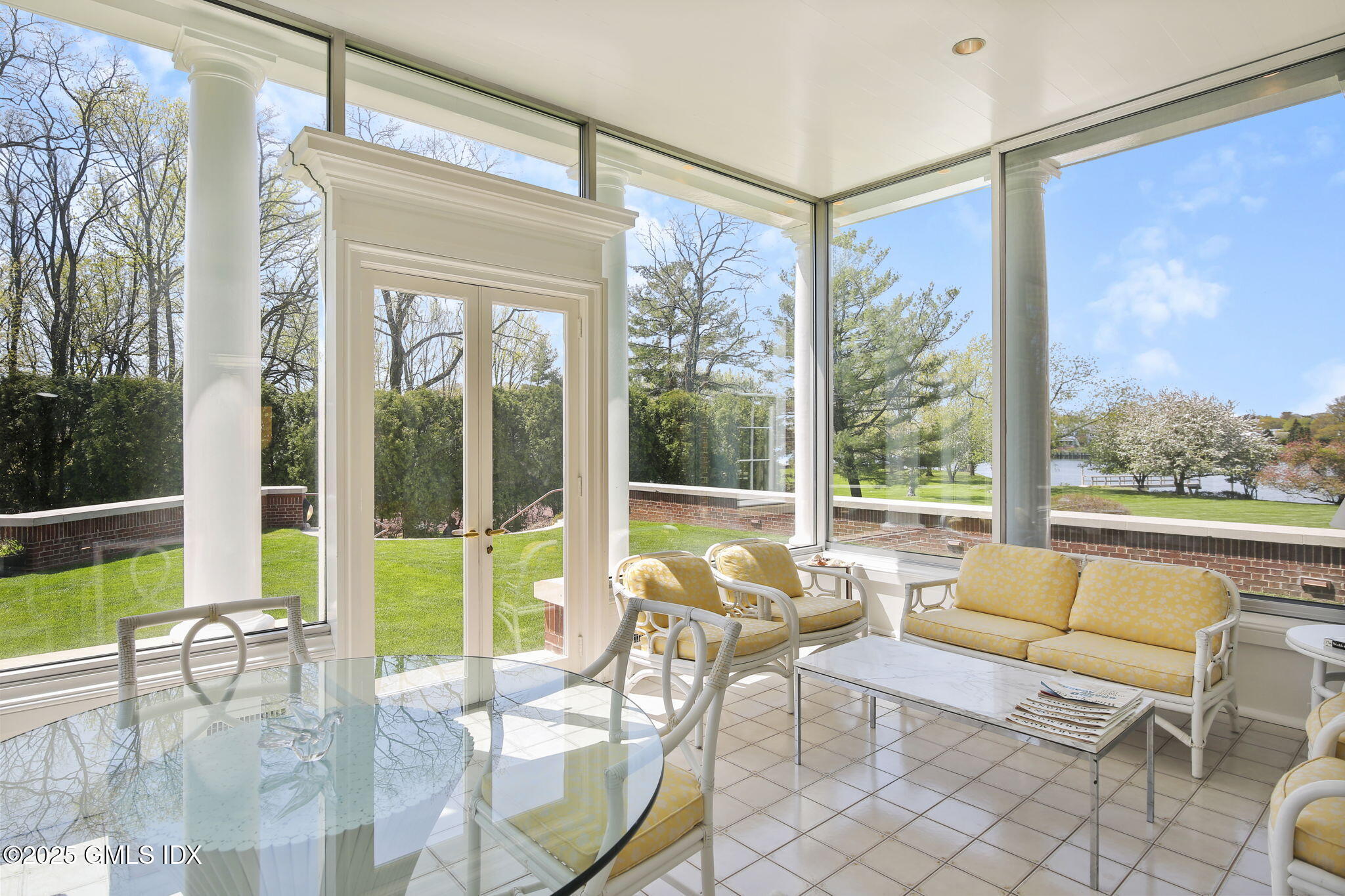 16 Windrose Way Greenwich, CT 06830 - Photo 6 of 18 a living room with furniture and floor to ceiling windows