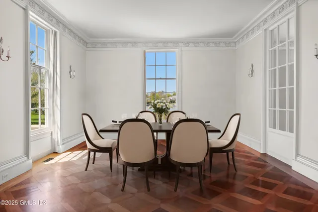 a view of a dining room with furniture window and outside view