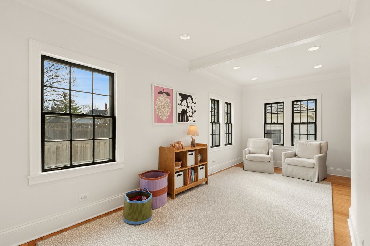 240 West St Charles Road Elmhurst, IL 60126 - Photo 11 of 41 a living room with furniture and a window