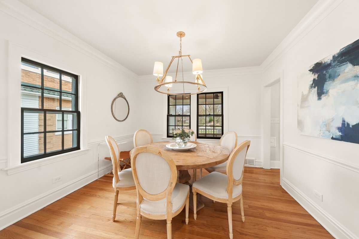 240 West St Charles Road Elmhurst, IL 60126 - Photo 20 of 41 a view of a dining room with furniture window and wooden floor