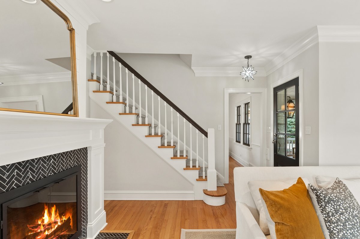 240 West St Charles Road Elmhurst, IL 60126 - Photo 5 of 41 a view of a livingroom with wooden floor and a fireplace