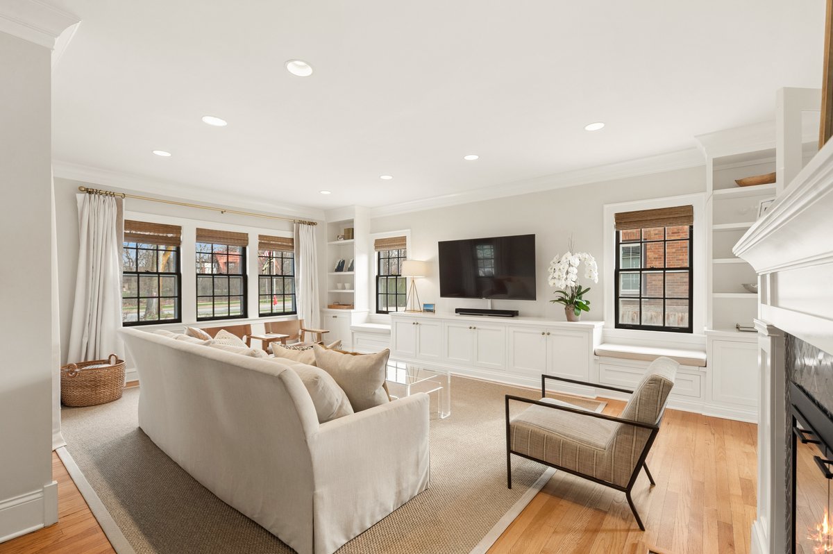 240 West St Charles Road Elmhurst, IL 60126 - Photo 6 of 41 a living room with furniture a flat screen tv and a fireplace