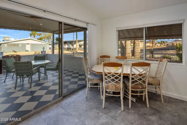 a view of a dining room with furniture window and outside view