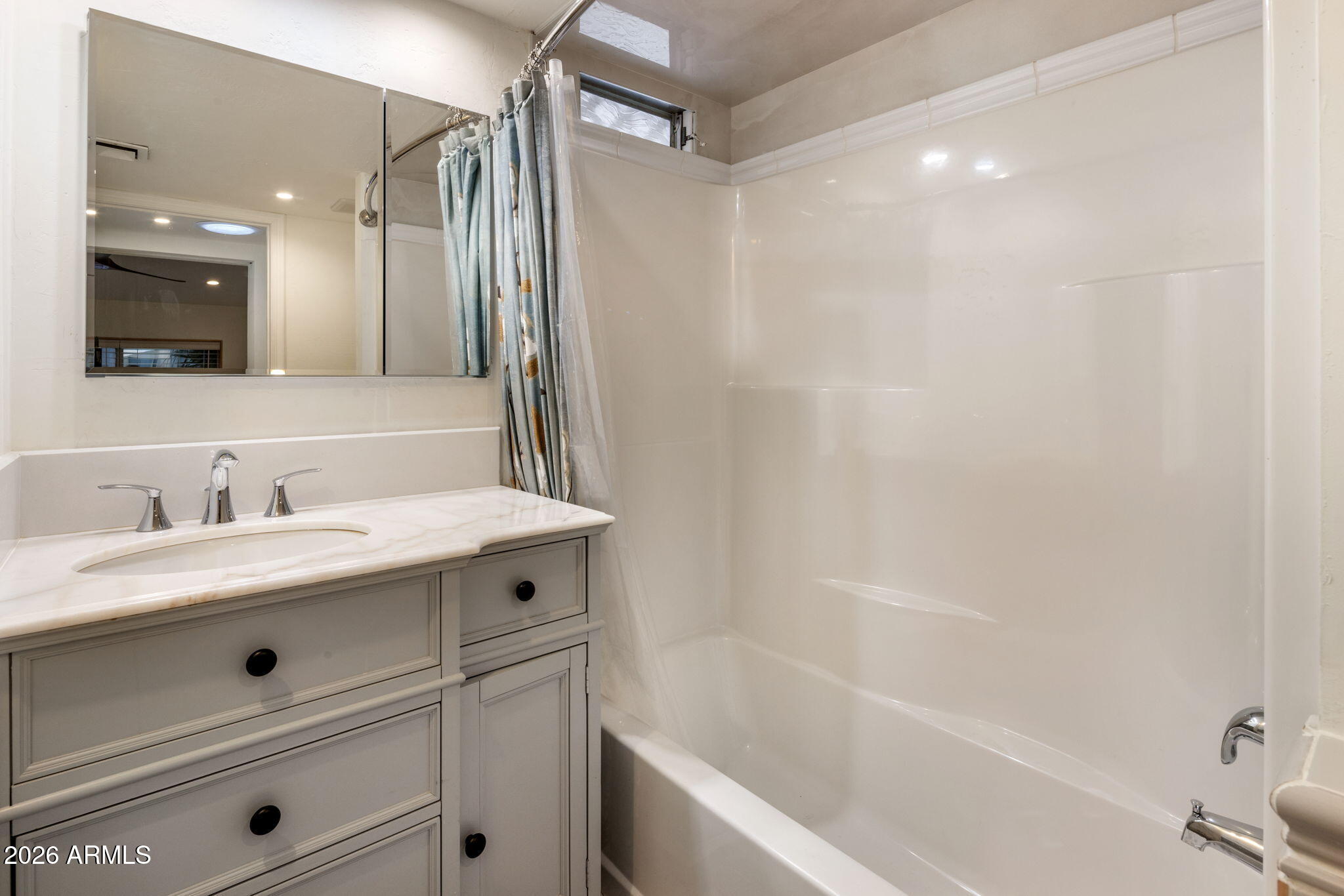 2311 North Gayridge Road Mesa, AZ 85215 - Photo 15 of 31 a bathroom with a sink a toilet a mirror and shower
