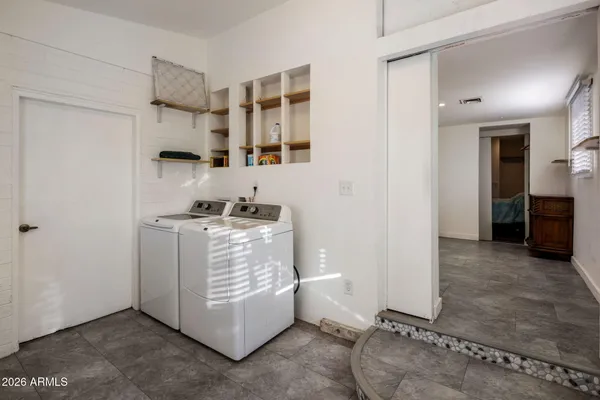a dining area with a table and chairs in it