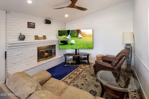 a living room with furniture and a fireplace