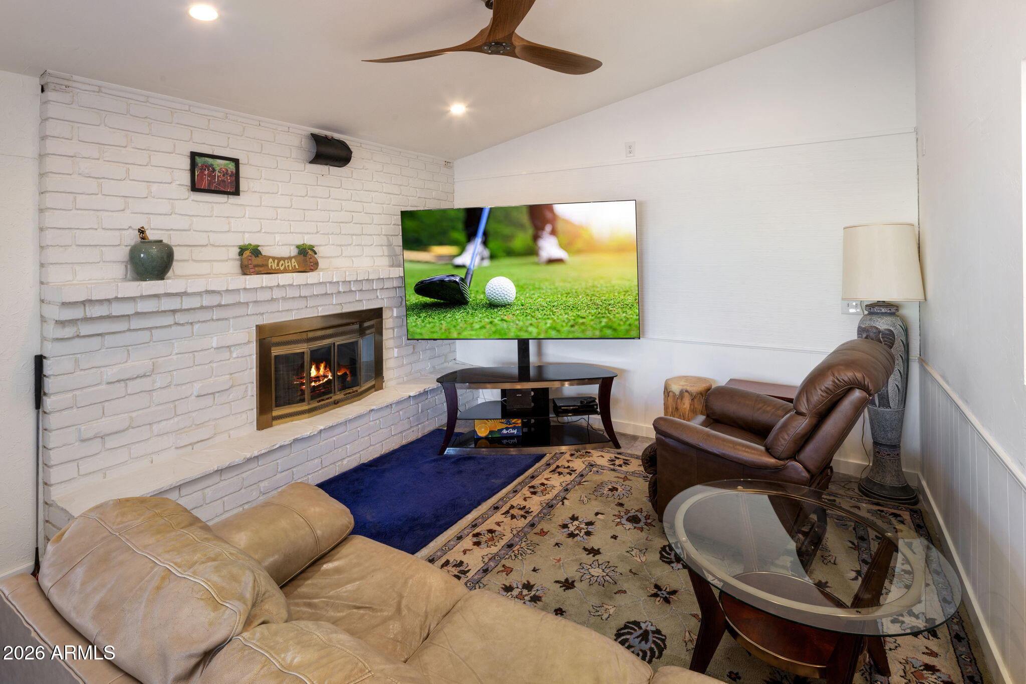 2311 North Gayridge Road Mesa, AZ 85215 - Photo 9 of 31 a living room with furniture and a fireplace