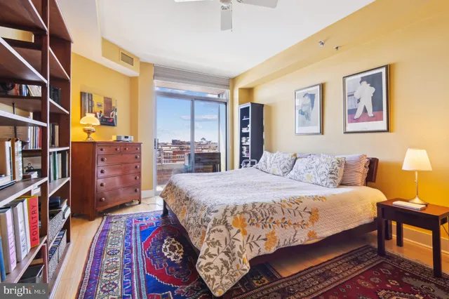 a bedroom with a bed furniture and a book shelf