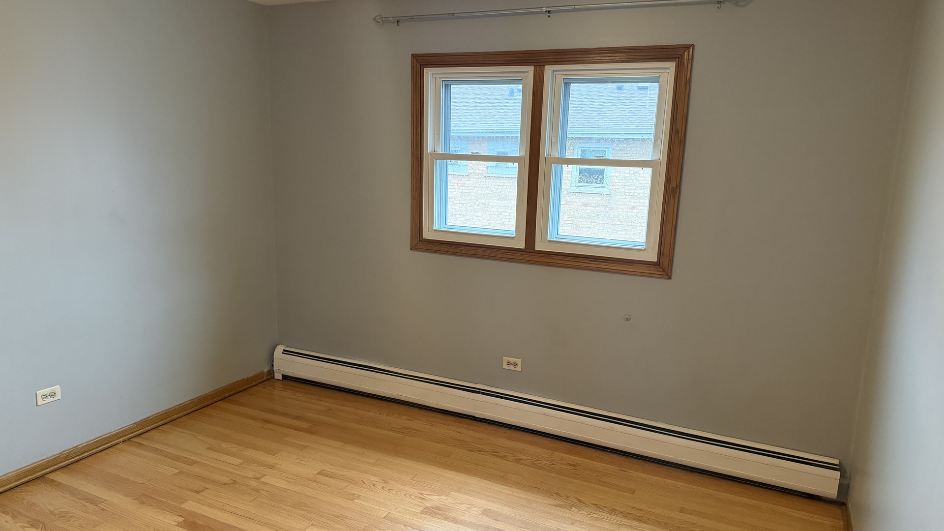 5124 South Kostner Avenue, Unit 2 Chicago, IL 60632 - Photo 12 of 12 an empty room with a window