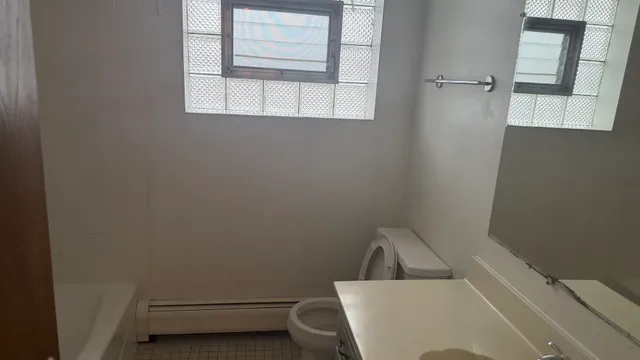 a view of a room that has a sink and a window