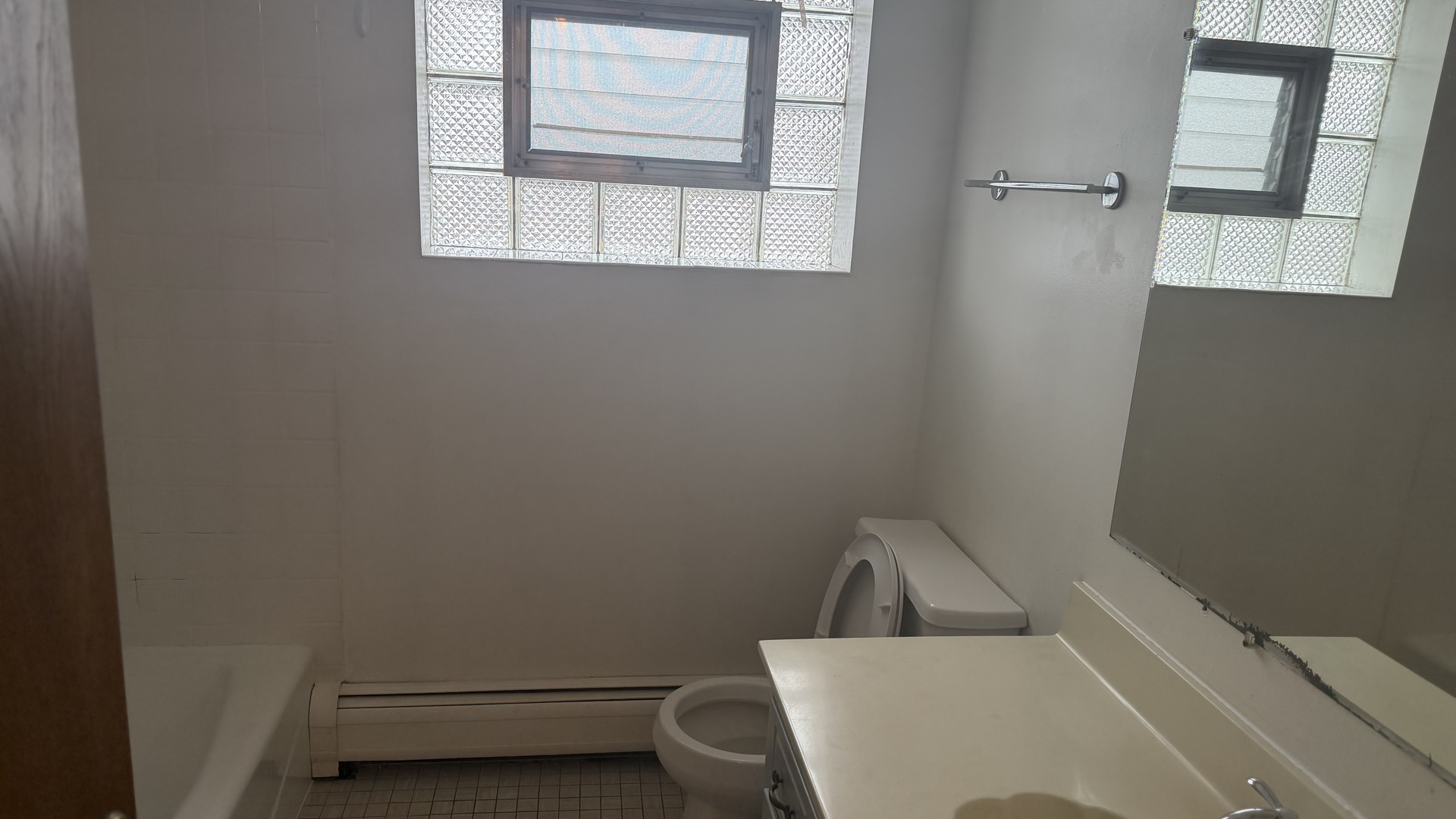 5124 South Kostner Avenue, Unit 2 Chicago, IL 60632 - Photo 7 of 12 a view of a room that has a sink and a window