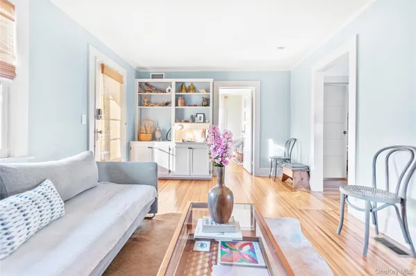 a living room with furniture and next to a window
