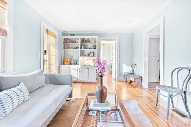 a living room with furniture and next to a window