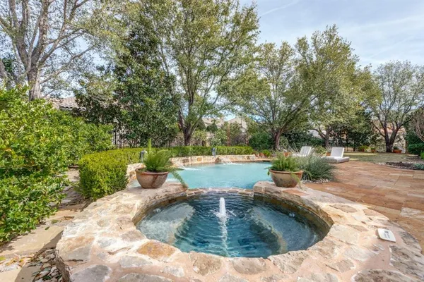 a view of a swimming pool with a sitting area