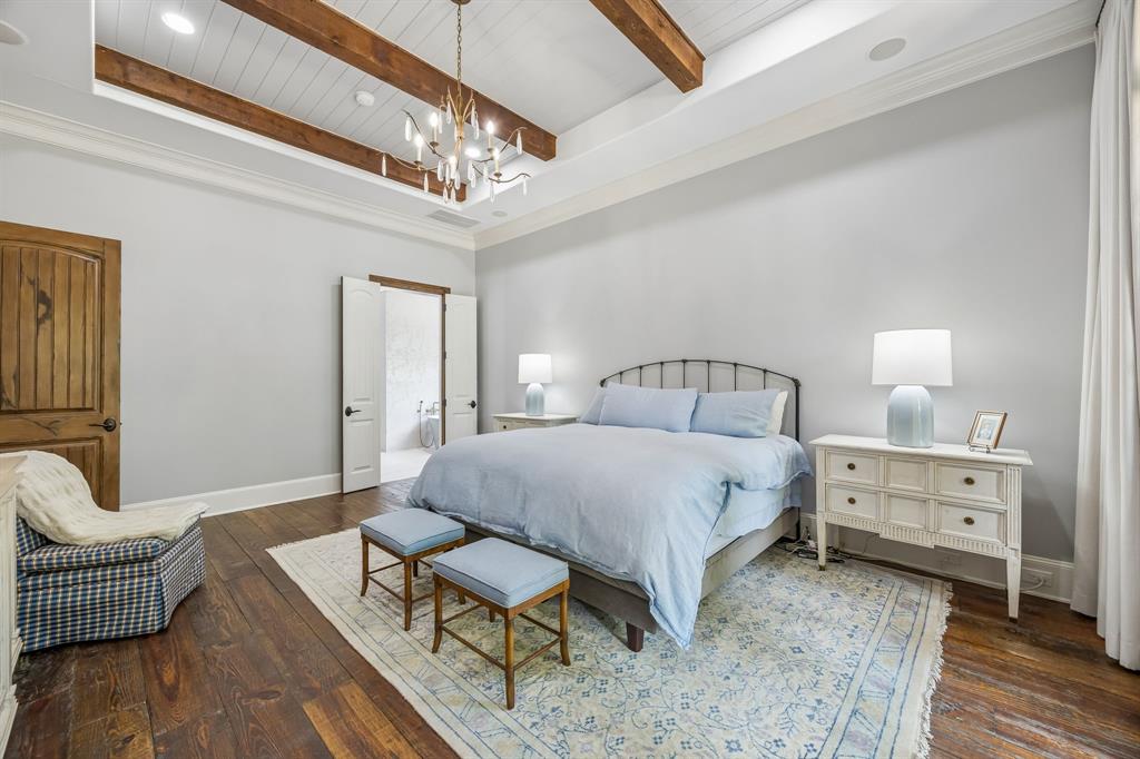 8000 Trading Post Drive McKinney, TX 75070 - Photo 17 of 37 a spacious bedroom with a bed and a chandelier