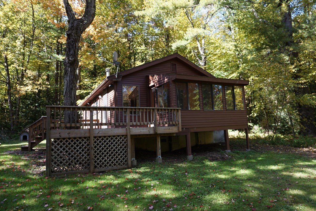 147 Thicket Road Tolland, MA 01034 - Photo 1 of 19 a view of a house with a deck