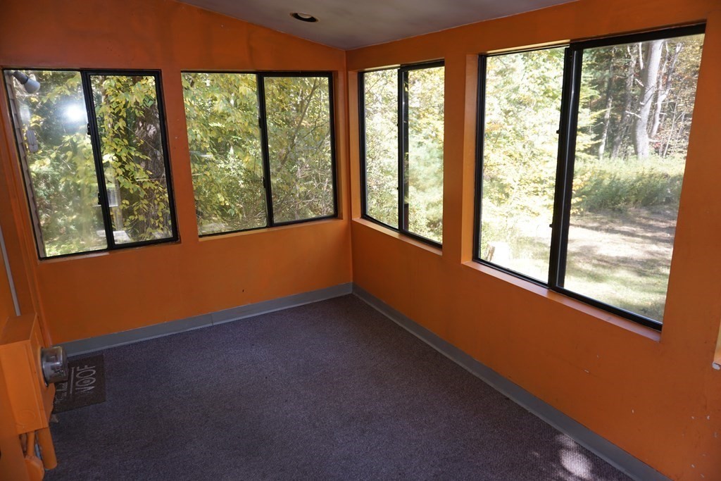147 Thicket Road Tolland, MA 01034 - Photo 7 of 19 a view of an empty room with a window